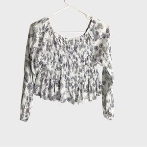 Never been worn, pretty floral and size M